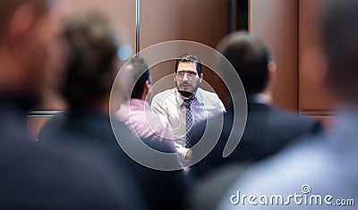 Skiled Businessman Presenting a Project to His Work Team atl Company Meeting. Stock Photo