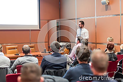 Skiled Public Speaker Giving a Talk at Business Meeting. Editorial Stock Photo