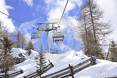 Skilifts towards the ski slopes in the Alps Editorial Stock Photo