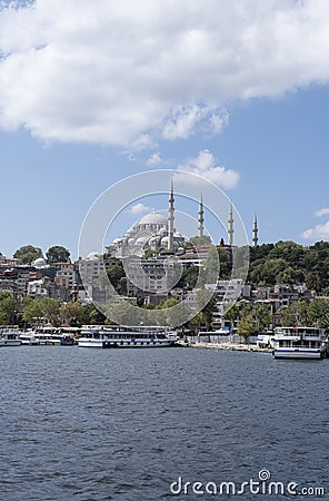 skiline of the city of Istanbul, with the Suleymaniye Mosque seen from the bosporus, sailboat over the Bosphorus, Suleiman mosque Stock Photo