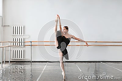 Skill ballet dancer shows stretching in class Stock Photo