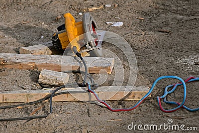 Skill saw left on ground at a construction site Stock Photo