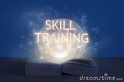 Light coming from open book with word skill training. Education concept Stock Photo