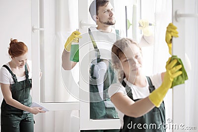 Skilled cleaning team washing windows Stock Photo