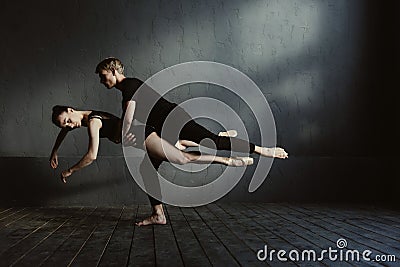 Skilled proficient ballet dancers demonstrating their flexibility Stock Photo