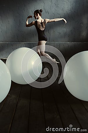 Skillful elegant dancer performing in the decorated studio Stock Photo