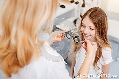 Skillful ophthalmologist looking for perfect lenses Stock Photo