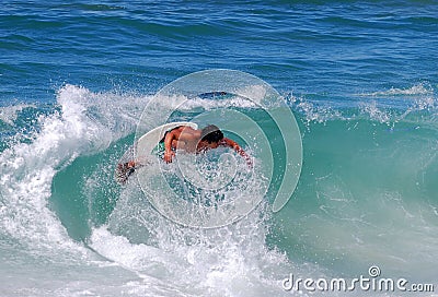 Skim boarder at Brooks Street Beach, Laguna Beach, CA Editorial Stock Photo