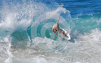 Skim Boarder riding a shore break wave at Aliso Beach in Laguna Beach, California. Editorial Stock Photo