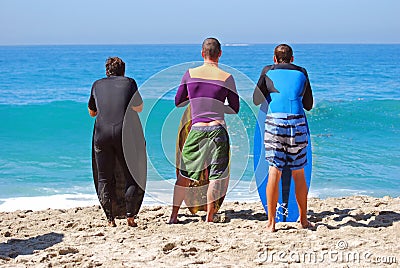 Skim Boarders wait for a wave to ride at Aliso Beach in Laguna Beach, California. Editorial Stock Photo