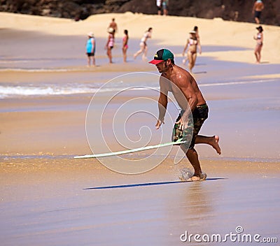 Skimboarding at Big Beach Editorial Stock Photo