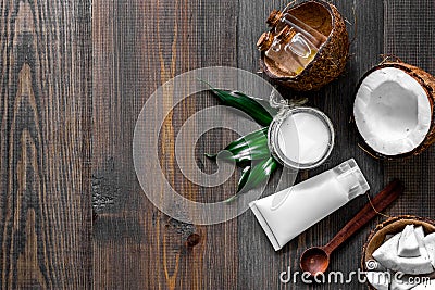 Skin care. Coconut cream and lotion on wooden table background top view copyspace Stock Photo