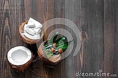Skin care. Coconut lotion on wooden table background top view copyspace Stock Photo