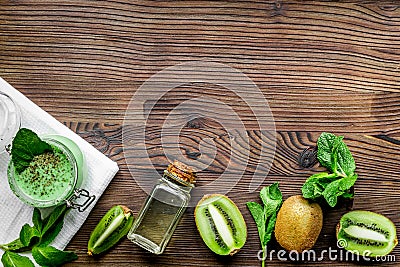 Skin care cosmetic with kiwi scrub on desk background top view mock-up Stock Photo