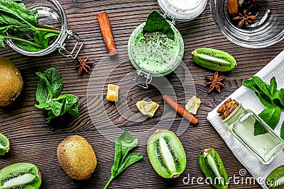 Skin care cosmetic with kiwi scrub on desk background top view Stock Photo