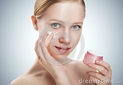 Skin care. happy beauty healthy girl with jar of cream Stock Photo