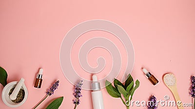 Skin care product on pink flat lay backgroung . organic beauty essential oil with herbal and lavender.aromatheraphy for wellness Stock Photo