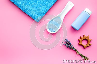 Skin care products for kids with lavender. Bottle, spa salt, towel and toy on pink background top view copyspace Stock Photo