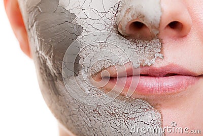 Skin care. Woman applying clay mask on face. Spa. Stock Photo