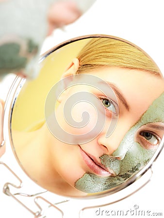 Skin care. Woman in clay mud mask on face. Beauty. Stock Photo