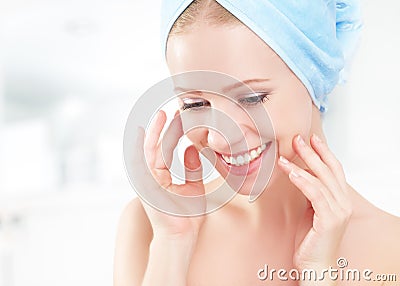 Skin care. young beautiful healthy girl in towel in bathroom Stock Photo