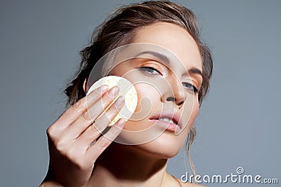 Skin cleansing and make-up removal with cosmetic sponge Stock Photo