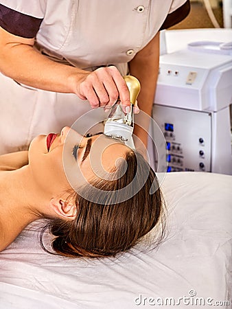 Skin resurfacing procedure facial procedure on ultrasound face machine. Stock Photo