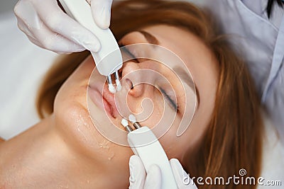 Skin treatment with microcurrents. Stock Photo