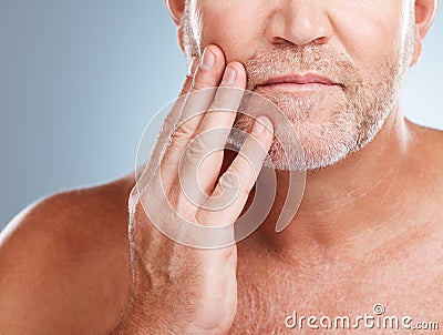 Skincare, beard and man model in a studio for a hygiene, grooming and cosmetic facial routine. Health, wellness and Stock Photo