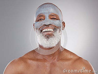 Skincare, clay mask and portrait of black man with smile, happiness and anti ageing treatment on studio background Stock Photo