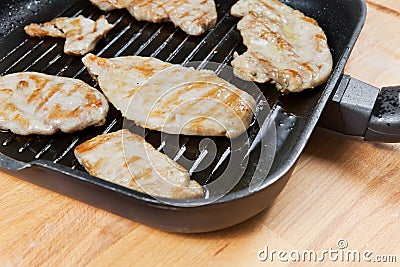 Skinless chicken breast in a pan Stock Photo