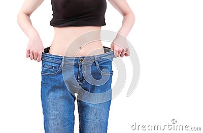 Skinny girl and baggy jeans Stock Photo