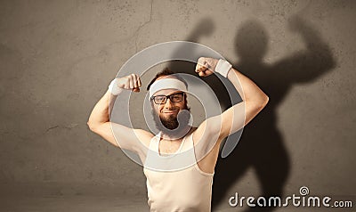 Skinny man with musculous shadow Stock Photo