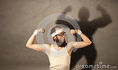 Skinny man with musculous shadow Stock Photo