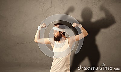 Skinny man with musculous shadow Stock Photo