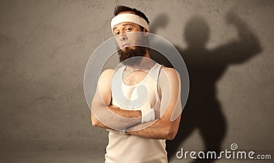 Skinny man with musculous shadow Stock Photo