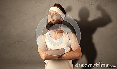 Skinny man with musculous shadow Stock Photo