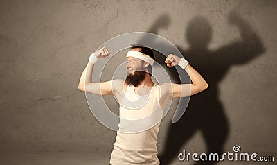 Skinny man with musculous shadow Stock Photo