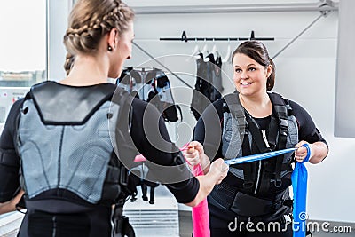 Skinny and plump woman having ems training together Stock Photo