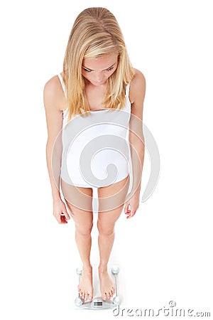 Skinny woman on body scale Stock Photo