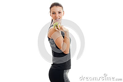 Skinny young fitness Lady eats an Apple and smiling Stock Photo