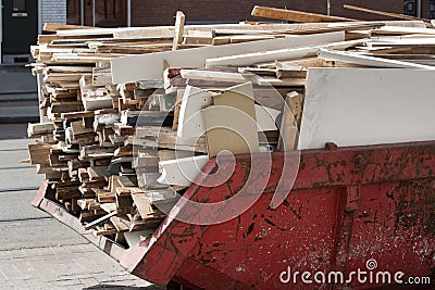 Skip loaded with old wood Stock Photo