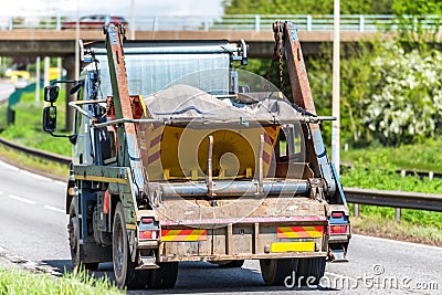 Skip lorry truck on uk motorway in fast motion Stock Photo