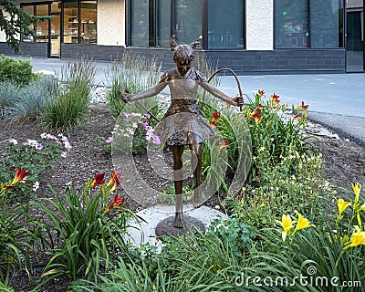`Skip Rope`, a bronze sculpture by Dennis Smith in Avon, Colorado. Editorial Stock Photo