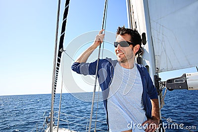 Skipper standing on sailing boat Stock Photo