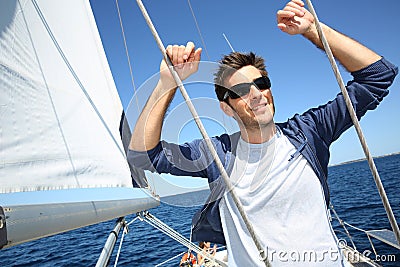 Skipper standing on y sailing boat Stock Photo