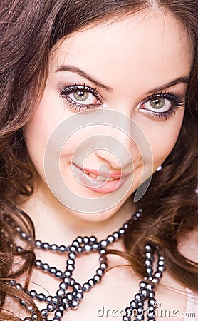 Skittish smiling young woman with be Stock Photo