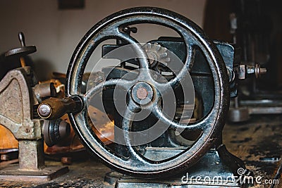 Hand crank cobblers leather skiver machine, vintage tools. Stock Photo