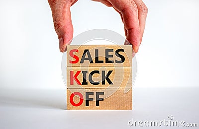 SKO sails kick off symbol. Concept words SKO sails kick off on wooden blocks. Beautiful white background, businessman hand, copy Stock Photo