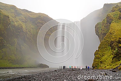 Skogafoss famous waterfall, Iceland and tourists Stock Photo